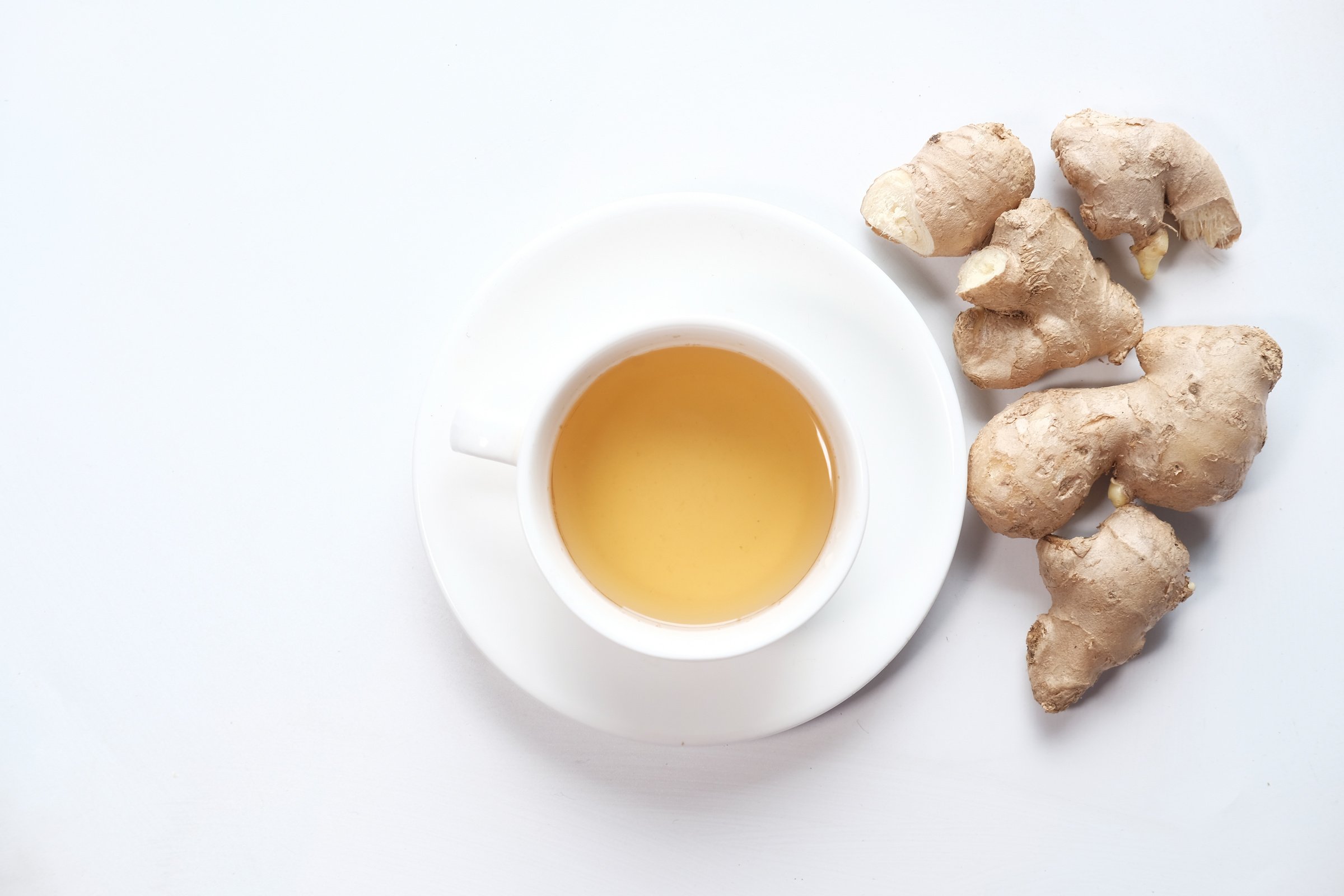 Cup of Ginger Tea on White Background